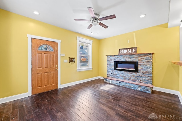 unfurnished living room featuring a fireplace, hardwood / wood-style flooring, and ceiling fan