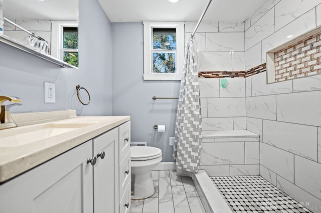 bathroom featuring curtained shower, vanity, and toilet