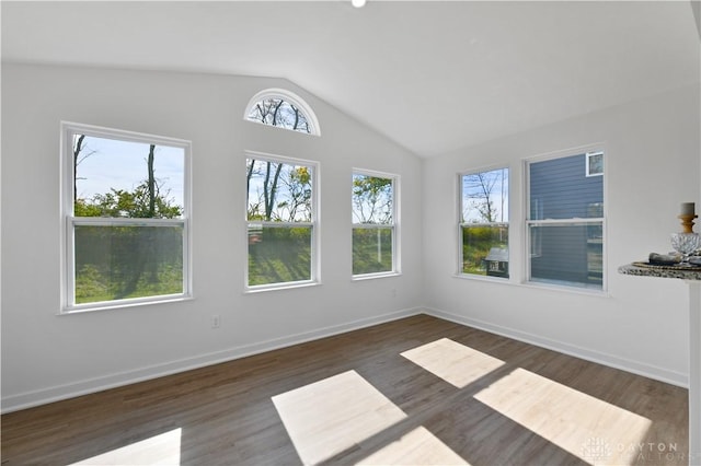 unfurnished sunroom featuring vaulted ceiling