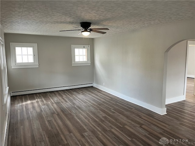 unfurnished room featuring a baseboard radiator, dark wood-type flooring, and ceiling fan