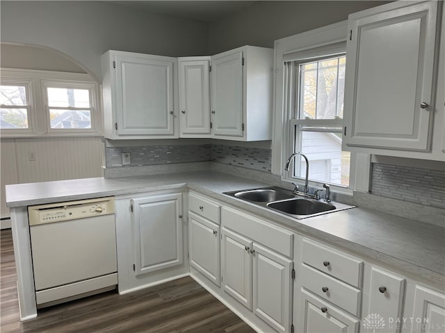 kitchen featuring white cabinetry, sink, backsplash, dishwasher, and dark hardwood / wood-style flooring