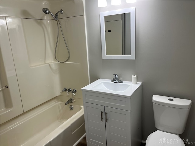 full bathroom featuring vanity, tub / shower combination, and toilet