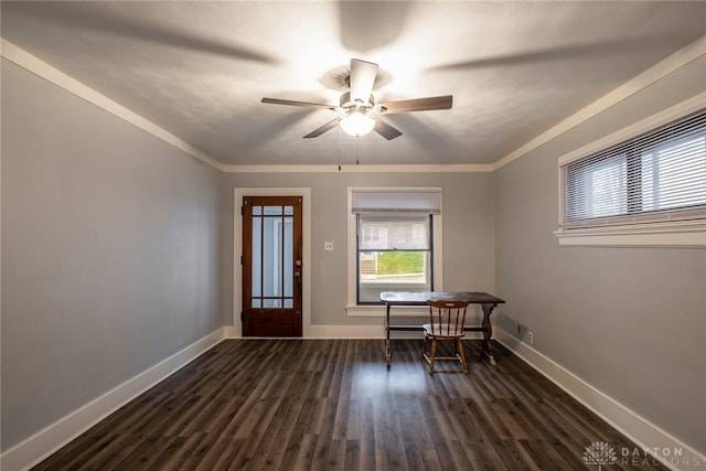 foyer with dark wood-type flooring, ceiling fan, and crown molding