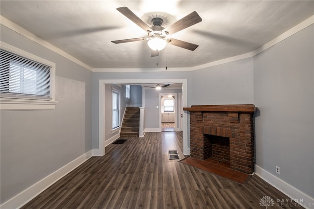 unfurnished living room with dark hardwood / wood-style flooring, ceiling fan, and ornamental molding