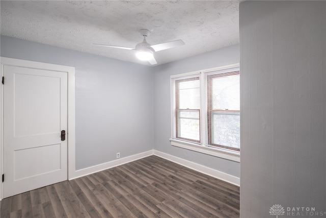 spare room featuring a textured ceiling, dark hardwood / wood-style flooring, and ceiling fan