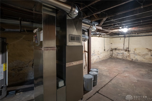 basement with water heater and heating unit