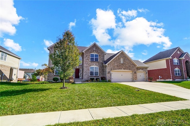 view of property featuring a garage and a front yard