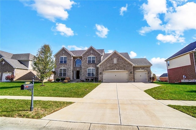 view of front of property featuring a garage and a front yard