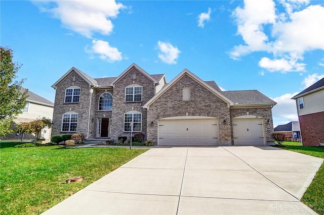 view of front of home featuring a garage and a front yard