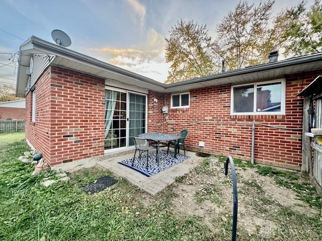 back of property with a patio area