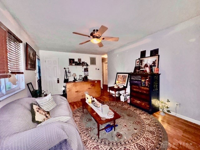 living room featuring hardwood / wood-style flooring and ceiling fan