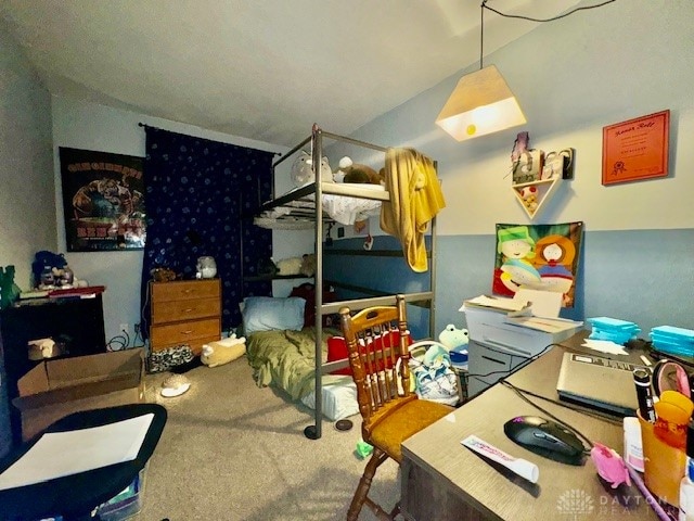 carpeted bedroom with vaulted ceiling