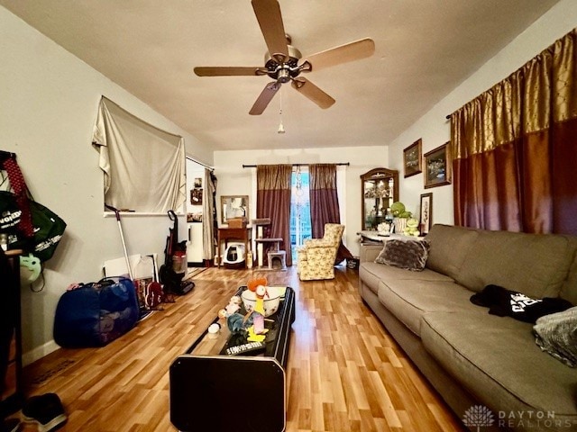 living room with hardwood / wood-style floors and ceiling fan