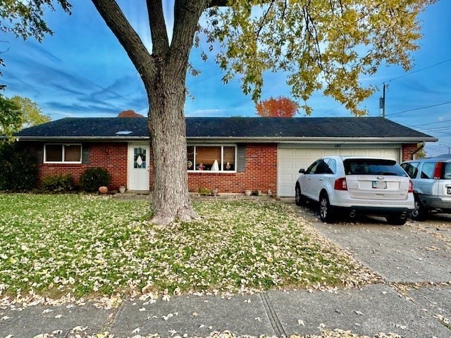 ranch-style house featuring a garage