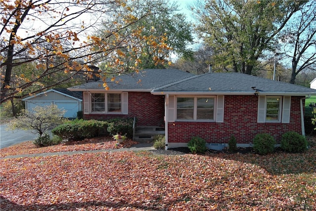 view of front facade featuring an outbuilding and a garage