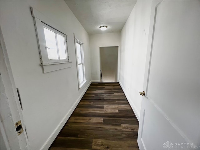 hall with dark hardwood / wood-style floors