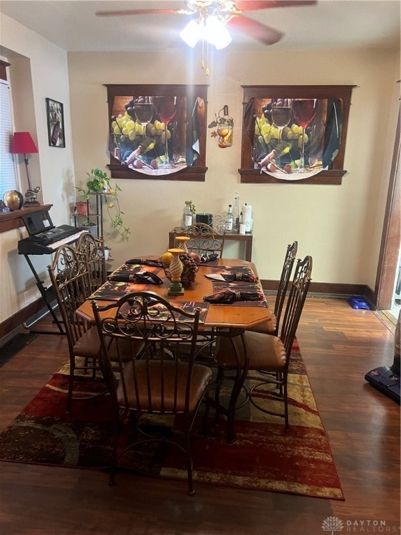 dining room with hardwood / wood-style floors and ceiling fan