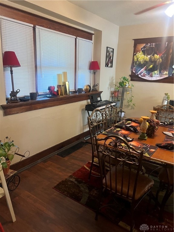 dining room with hardwood / wood-style floors and ceiling fan