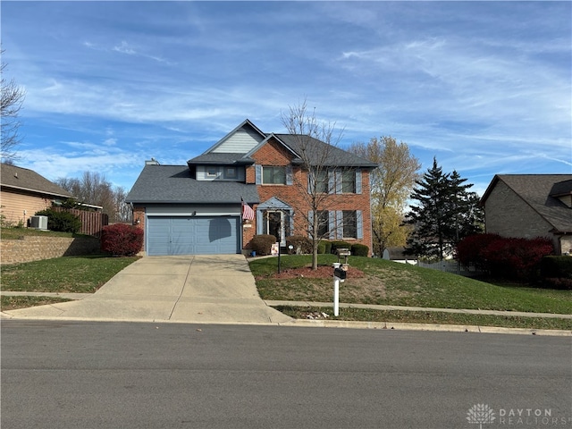 front facade featuring central AC, a garage, and a front lawn