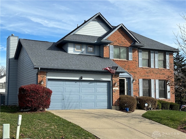 view of front of home featuring a front yard and a garage