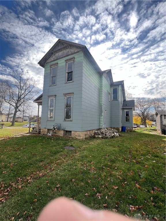 view of property exterior featuring a yard