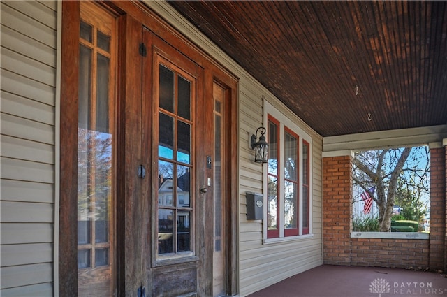 unfurnished sunroom featuring wooden ceiling