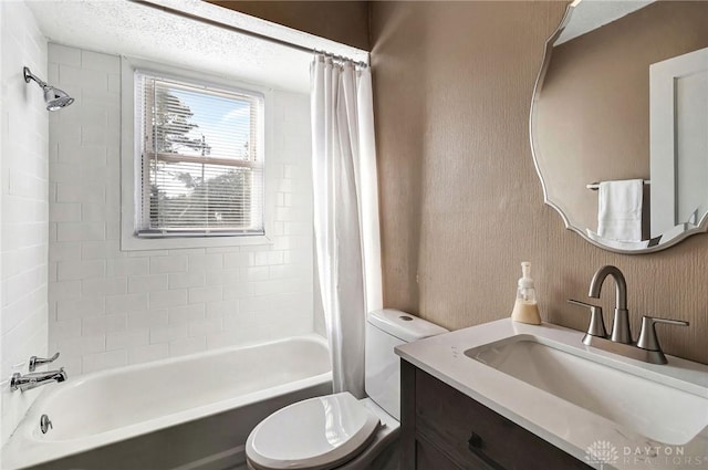 full bathroom with vanity, toilet, and shower / tub combo