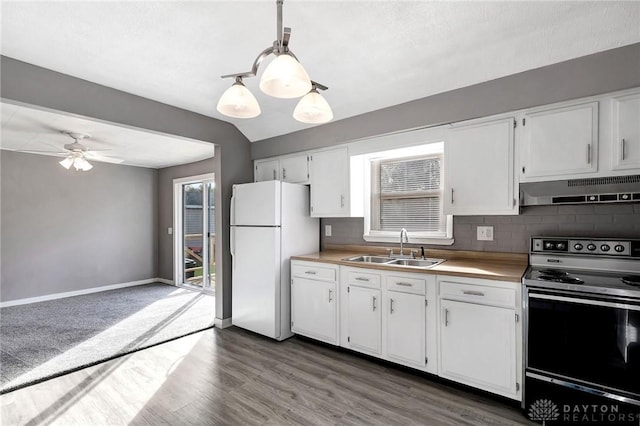 kitchen with range with electric cooktop, ceiling fan, sink, pendant lighting, and white refrigerator