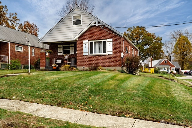 bungalow-style house featuring a front lawn