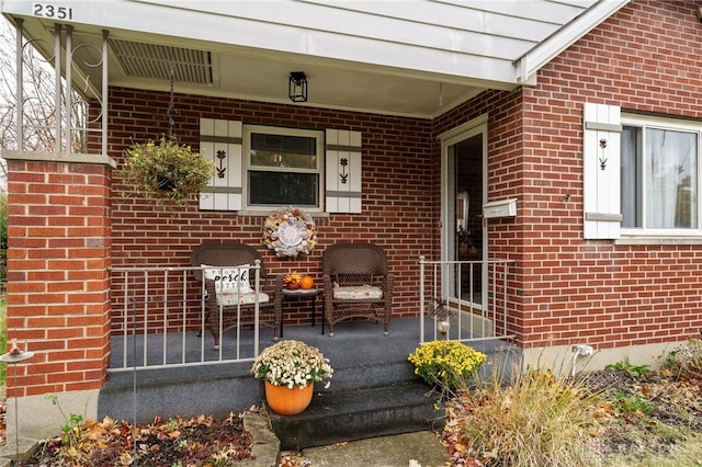 view of exterior entry with covered porch