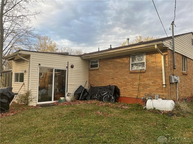 rear view of house with a lawn