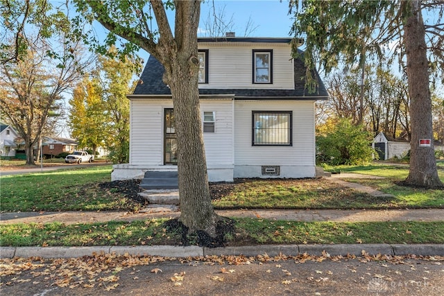 view of front of home with a front yard