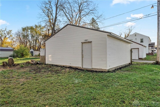 view of outbuilding featuring a lawn