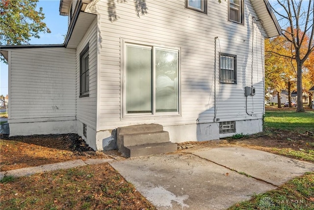 view of property exterior with a patio