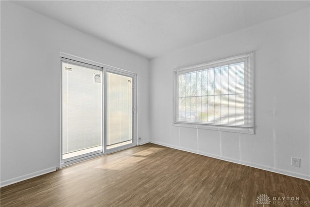 spare room featuring dark hardwood / wood-style floors