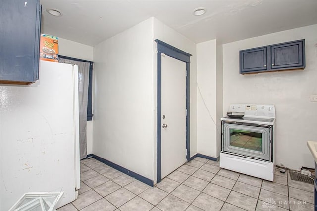 kitchen with white appliances and light tile patterned floors