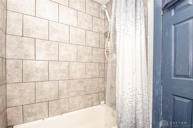 bathroom featuring shower / bathtub combination with curtain