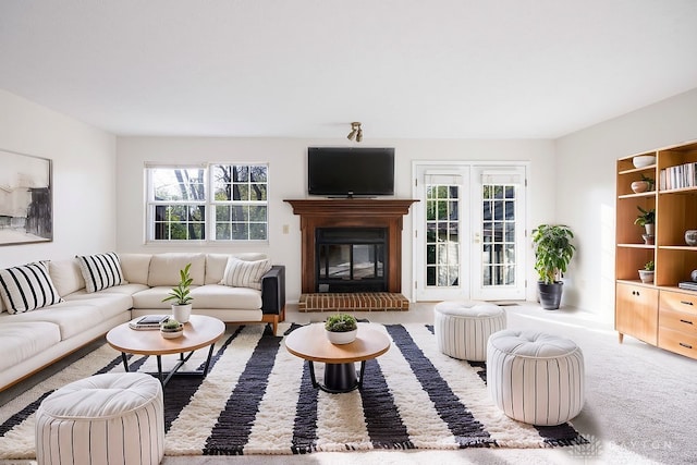 carpeted living room featuring french doors