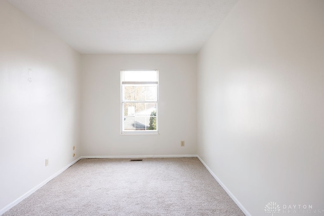 empty room featuring carpet floors