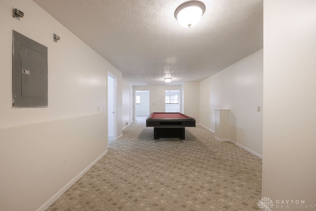 playroom with electric panel, a textured ceiling, carpet floors, and pool table