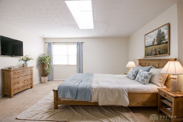 carpeted bedroom featuring a textured ceiling