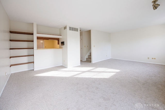 interior space featuring light carpet