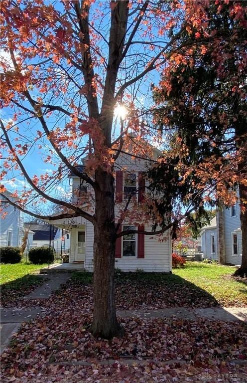 view of home's exterior with a yard