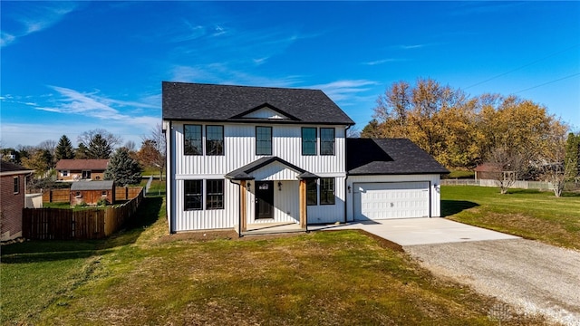 view of front facade featuring a garage and a front lawn