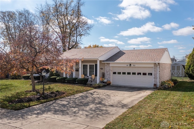 single story home with a front lawn and a garage