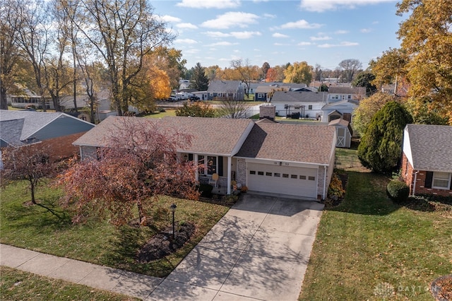 single story home with a garage and a front yard