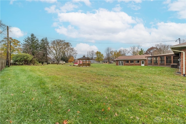 view of yard with a sunroom