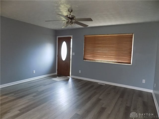 foyer entrance featuring ceiling fan and dark hardwood / wood-style flooring