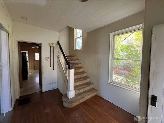 staircase featuring hardwood / wood-style floors