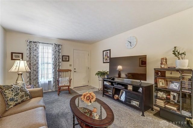 living room featuring light carpet